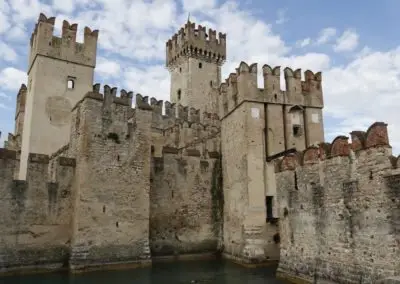 Scaliger castle Sirmione medieval town Garda lake, port fortification of the middle ages. It presents the typical Ghibelline swallowtail merlons.Day tour wiht Sightseeing in Italy